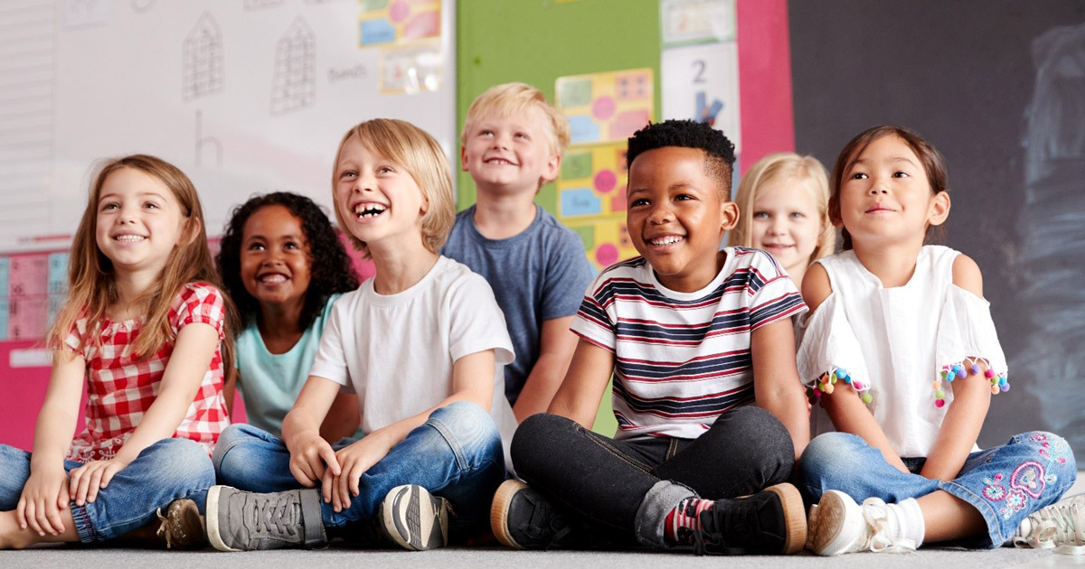 Kids sitting in a group in classroom